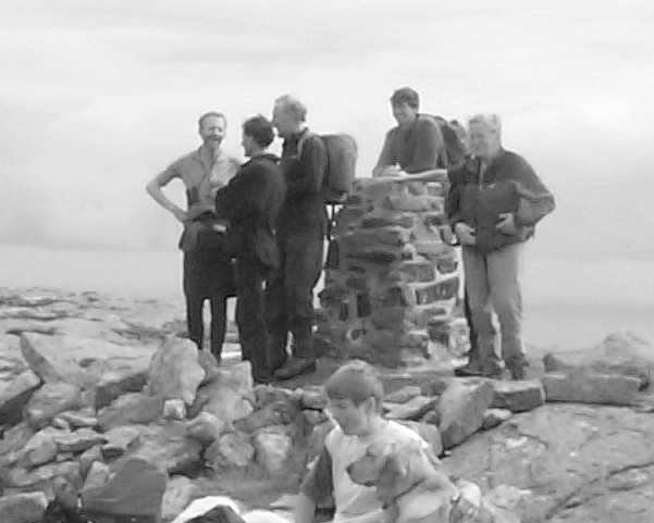Ann Bowker (right) enjoys the spacious rocky summit of Sandray, in the company of Rob Woodall, Eddie Harwood, Chris Watson, Dave Butterfield and Lynda Woods.