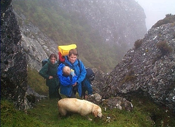 Lynda Woods makes her way up steep rock on Sgurr Bhuidhe, baby in one hand, dog lead in the other