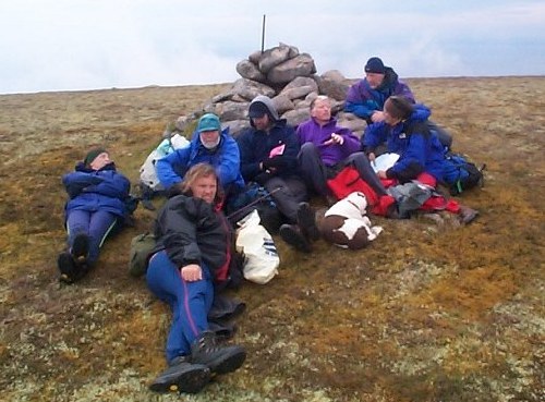 Richard Webb and company relaxing on top of Beinn Mhealaich during the Marhof 2002 gathering at Golspie